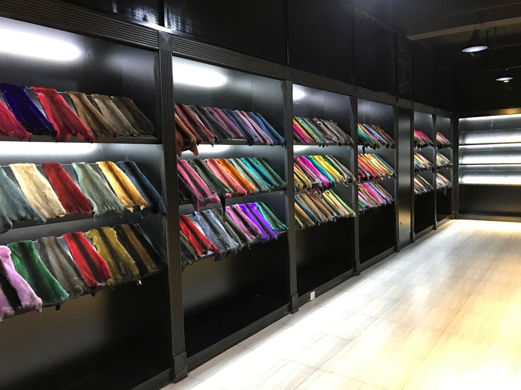Angled wall display of dyed fur samples