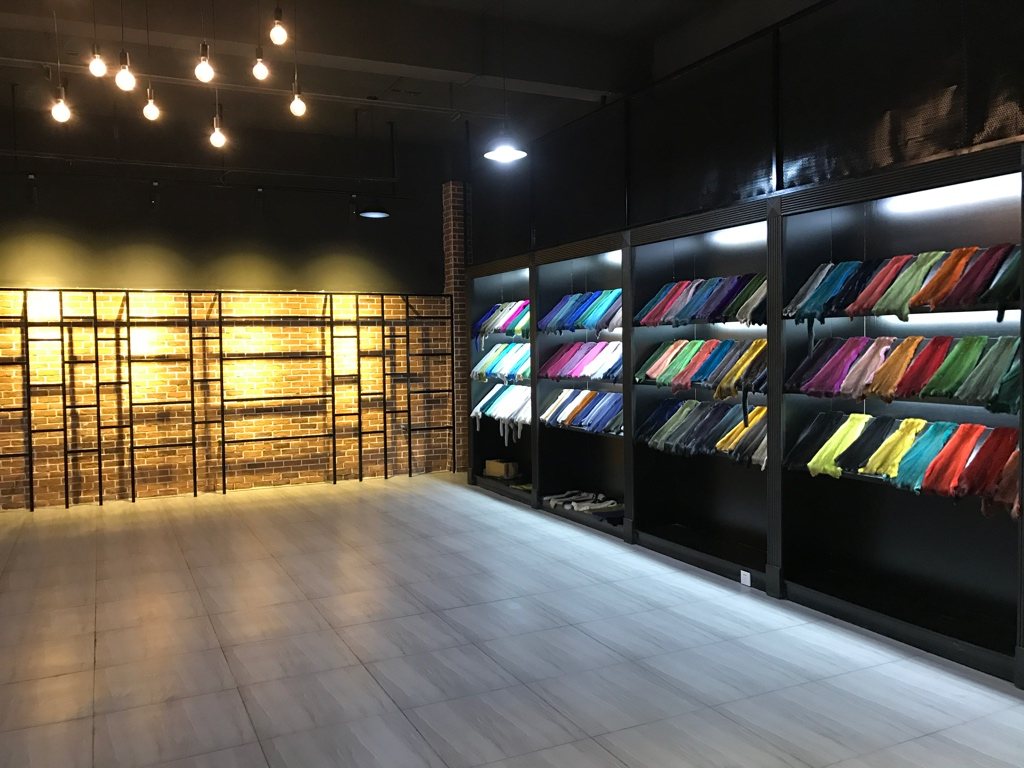 Showroom with dyed fur samples and warm display lighting
